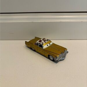 Disney Cars Tex Dinoco die cast Car